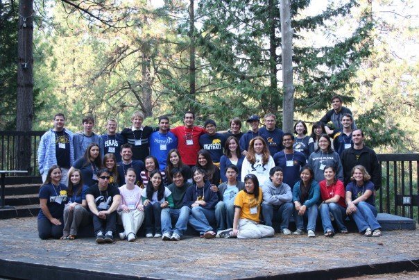 Fall 2007 retreat group picture on wooden stage in the forest.